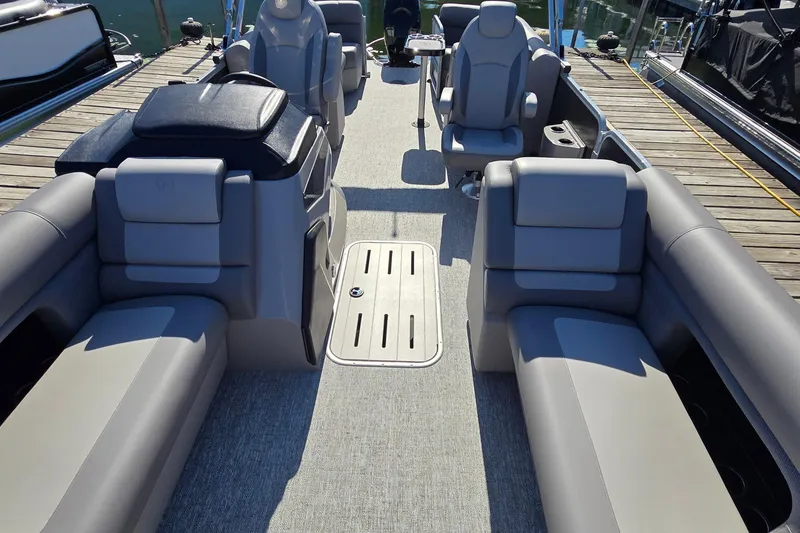 Slide: The Image of 2025 Premier 230 SunSation RF pontoon boat interior with luxurious seating and modern design. - 22