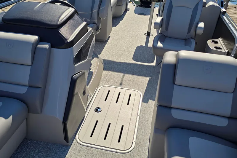Slide: The Image of 2025 Premier 230 SunSation RF boat interior with plush seating and modern design. - 23