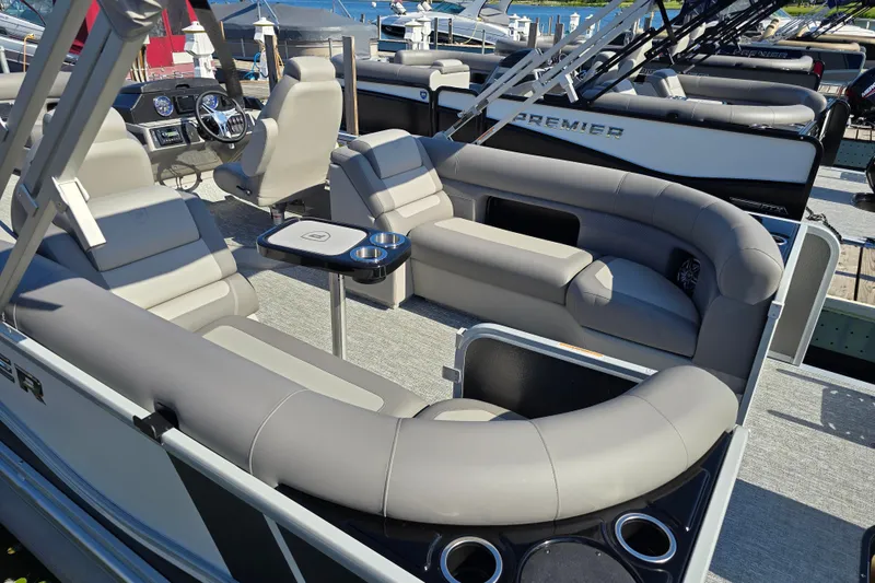 Slide: The Image of 2025 Premier 230 SunSation RF pontoon boat with luxurious seating and modern dashboard. - 9