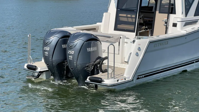 Slide: The Image of 2026 Cutwater C-288 Coupe with dual Yamaha 250 V6 engines on water. - 2