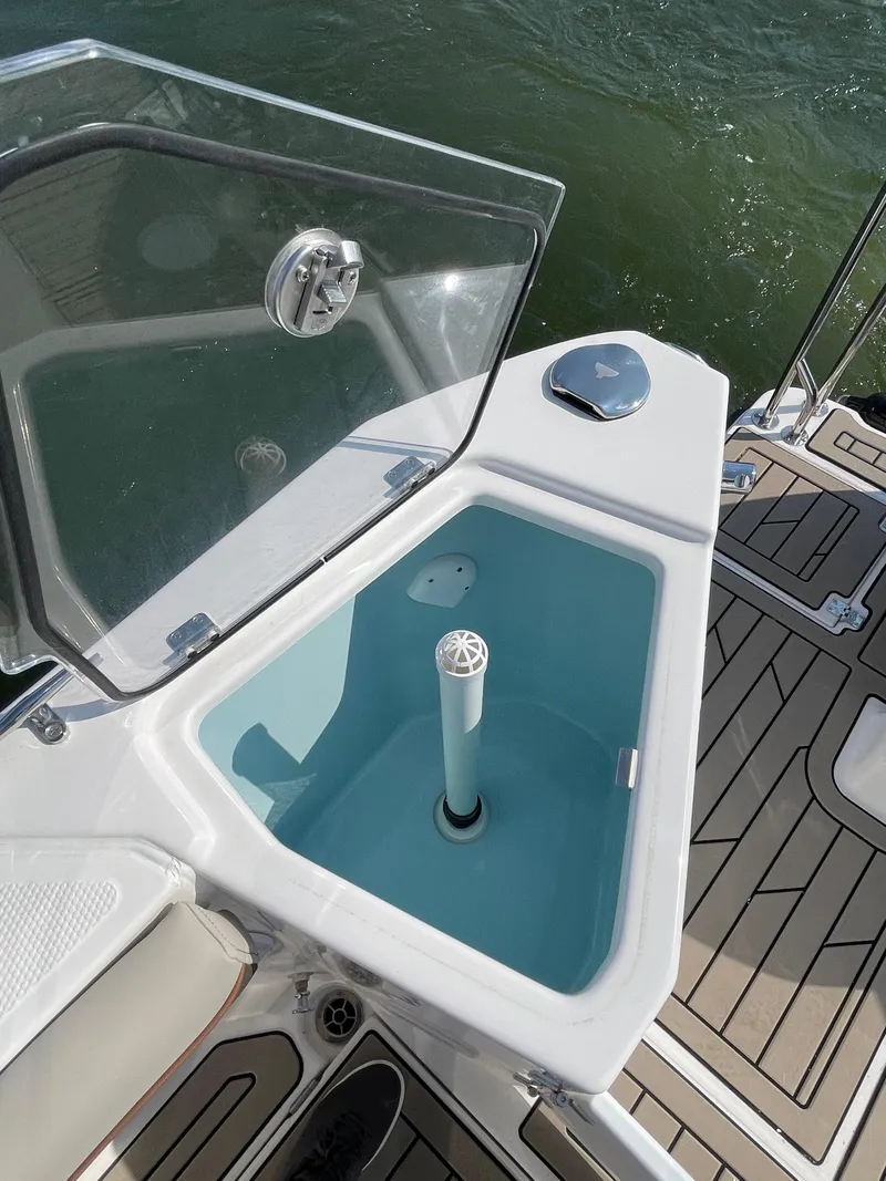 Slide: The Image of 2026 Cutwater C-288 Coupe boat deck with open storage compartment. - 23