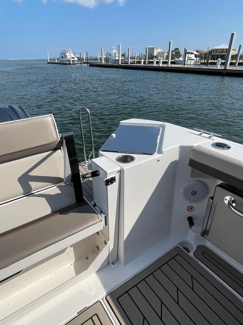 Slide: The Image of 2026 Cutwater C-288 Coupe boat interior with seating and water view at marina. - 24