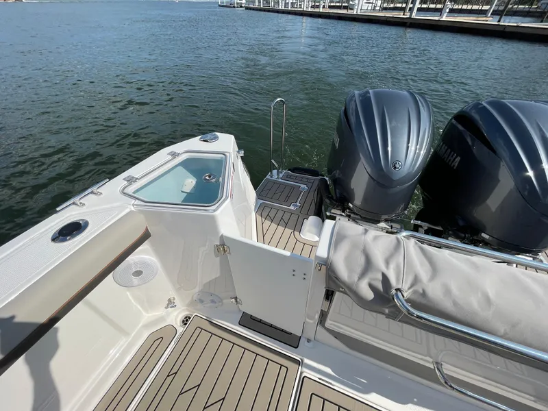 Slide: The Image of 2026 Cutwater C-288 Coupe boat with twin Yamaha engines docked on water. - 27
