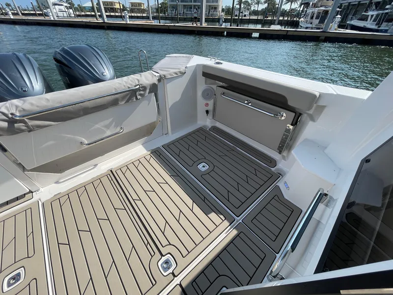 Slide: The Image of 2026 Cutwater C-288 Coupe boat deck with sleek design and twin engines. - 28