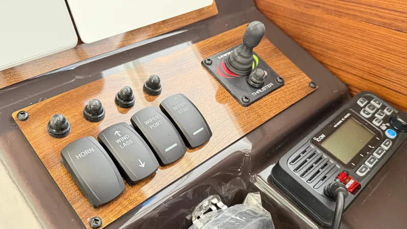 Slide: The Image of Control panel of 2026 Ranger Tugs R-27 with switches and joystick. - 20