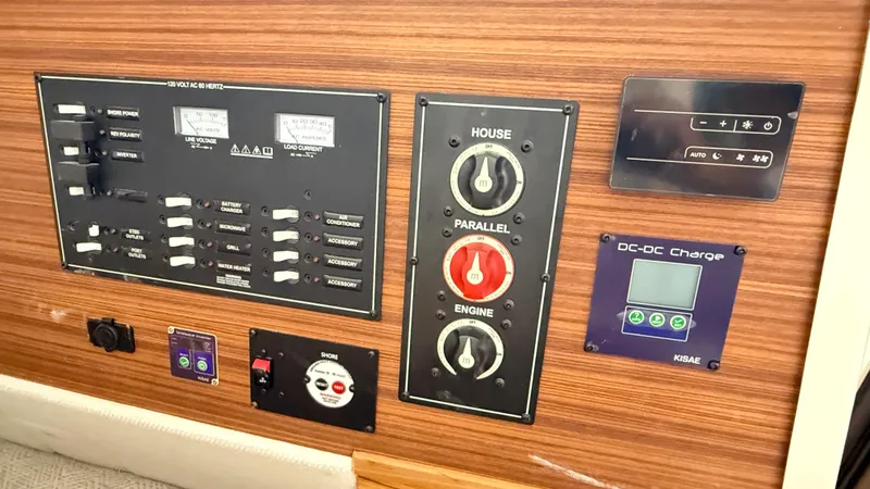 Slide: The Image of Electrical control panel of 2026 Ranger Tugs R-27 boat with switches and gauges. - 26
