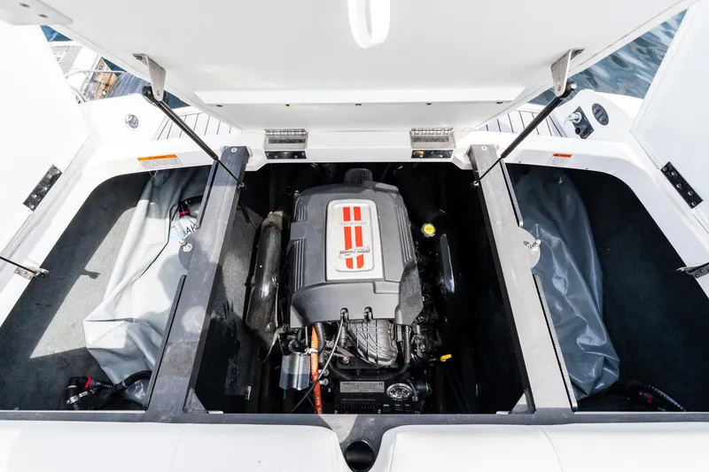 Slide: The Image of 2008 MasterCraft MariStar 235 SS engine compartment with open hatch, showcasing the engine. - 8
