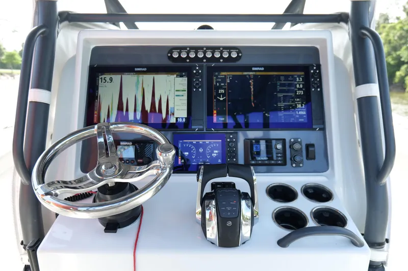 Slide: The Image of Control panel of 2022 Yellowfin 34 Offshore boat with advanced navigation displays. - 10