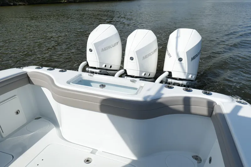 Slide: The Image of 2022 Yellowfin 34 Offshore boat with triple Mercury outboard engines on water. - 16
