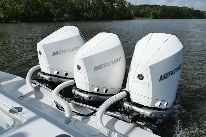Slide: The Image of Triple Mercury outboard engines on a 2022 Yellowfin 34 Offshore boat. - 17
