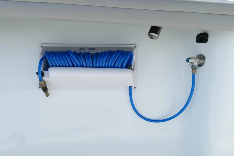 Slide: The Image of Blue coiled hose on 2022 Yellowfin 34 Offshore boat. - 27
