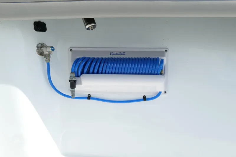 Slide: The Image of Blue coiled hose on 2022 Yellowfin 34 Offshore boat, mounted on white panel. - 28