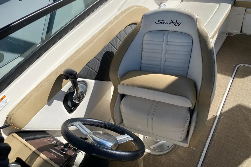 Slide: The Image of 2018 Sea Ray SPX 230 boat interior with seating and windshield detail. - 10