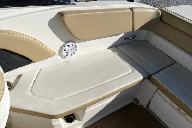 Slide: The Image of Interior view of 2018 Sea Ray SPX 230 boat cockpit with steering wheel and controls. - 18