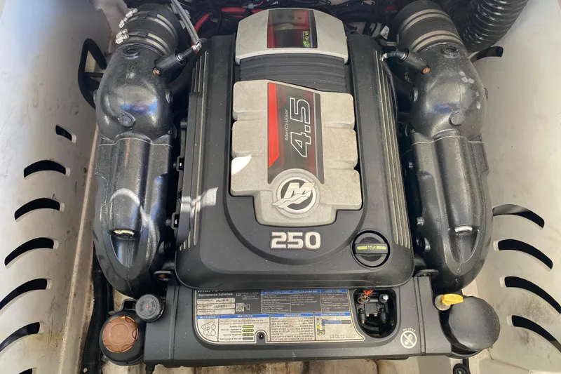 Slide: The Image of Open engine compartment of 2018 Sea Ray SPX 230 boat, showcasing the engine. - 25