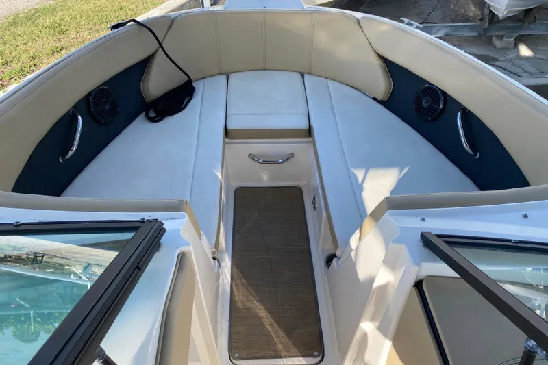 Slide: The Image of 2018 Sea Ray SPX 230 boat rear view on trailer, showcasing swim platform. - 5