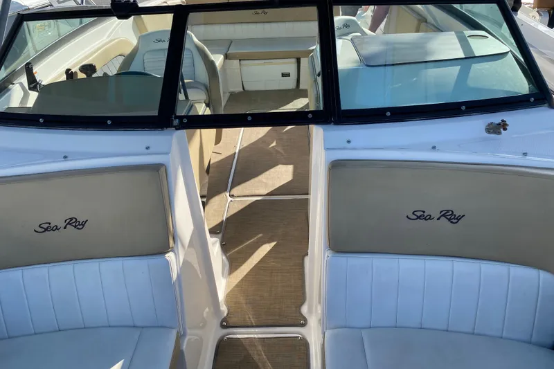 Slide: The Image of 2018 Sea Ray SPX 230 boat interior with beige seating and speakers. - 6