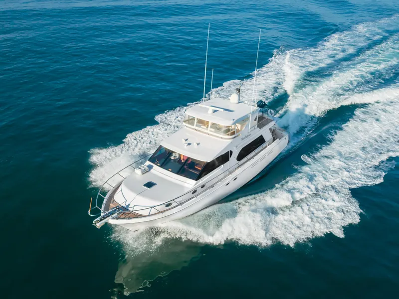 Slide: The Image of 2003 Ocean Alexander 64 Pilothouse yacht cruising on open water. - 15