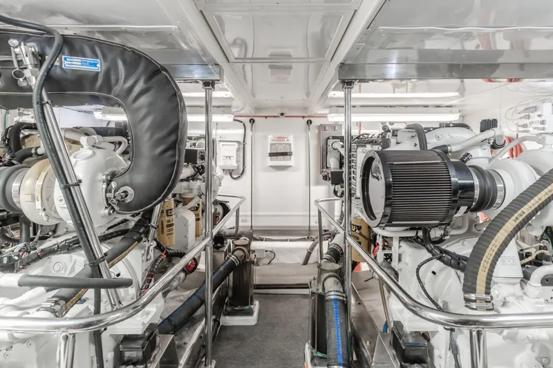 Slide: The Image of Engine room of 2003 Ocean Alexander 64 Pilothouse yacht, showcasing machinery and equipment. - 29