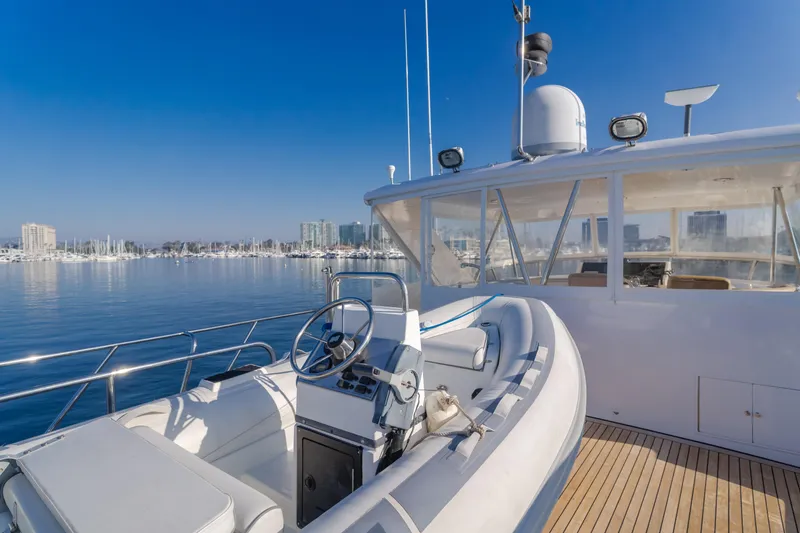 Slide: The Image of 2003 Ocean Alexander 64 Pilothouse yacht with scenic marina backdrop. - 35