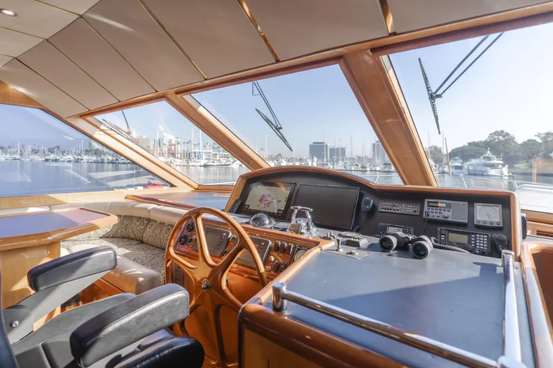 Slide: The Image of Pilothouse interior of 2003 Ocean Alexander 64, featuring navigation equipment and panoramic windows. - 39