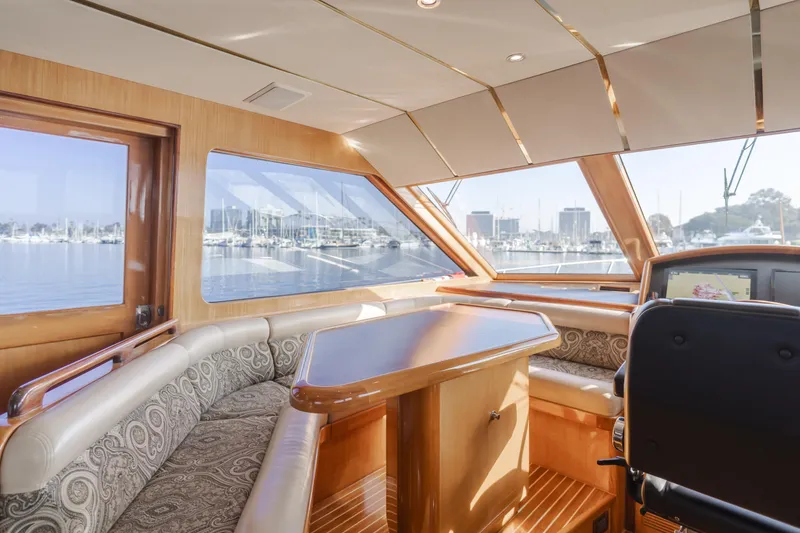 Slide: The Image of Luxurious interior of 2003 Ocean Alexander 64 Pilothouse yacht with scenic marina view. - 40