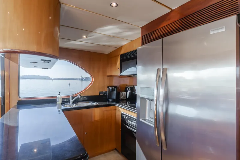 Slide: The Image of Luxurious kitchen interior of 2003 Ocean Alexander 64 Pilothouse yacht with modern appliances. - 41