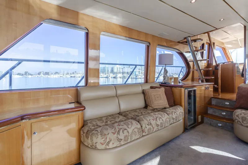 Slide: The Image of Luxurious interior of 2003 Ocean Alexander 64 Pilothouse yacht with plush seating and large windows. - 45