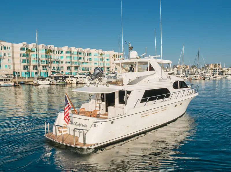 Slide: The Image of 2003 Ocean Alexander 64 Pilothouse yacht docked in a marina, clear blue sky. - 7