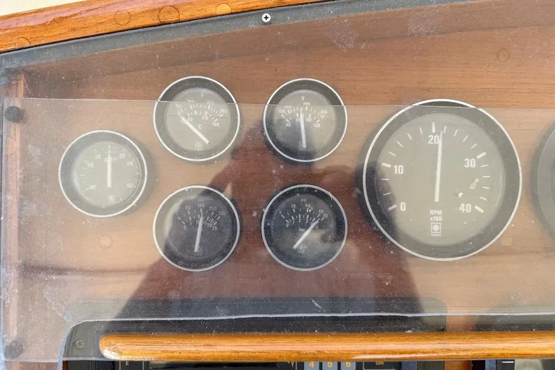 Slide: The Image of Dashboard gauges of a 1990 Nauset Flybridge Cruiser with Extended Hardtop. - 61