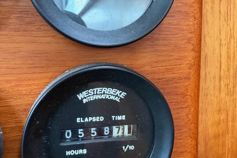 Slide: The Image of Westerbeke engine hour meter showing 5587.1 hours on Nauset Flybridge Cruiser, 1990 model. - 69