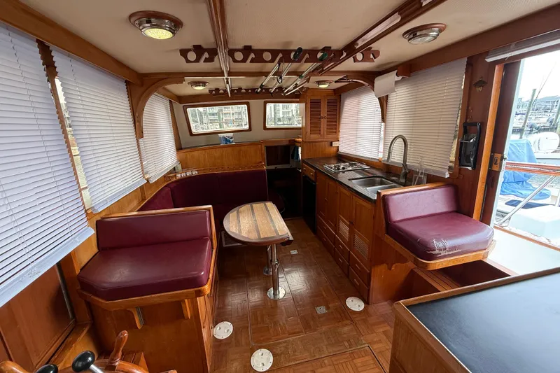 Slide: The Image of Interior of 1984 Chien Hwa 35 Trawler with wood finish and maroon seating. - 10