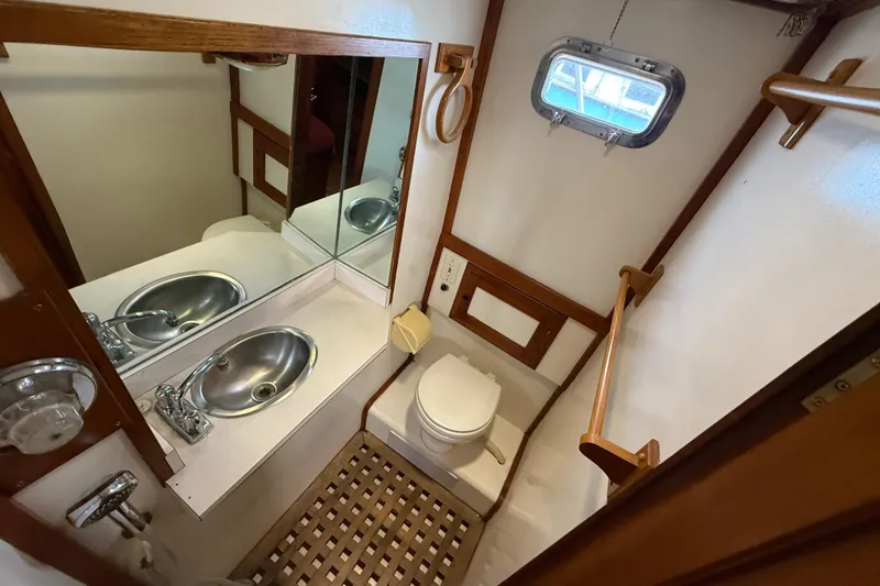 Slide: The Image of 1984 Chien Hwa 35 Trawler bathroom with sink, toilet, and mirror. - 14