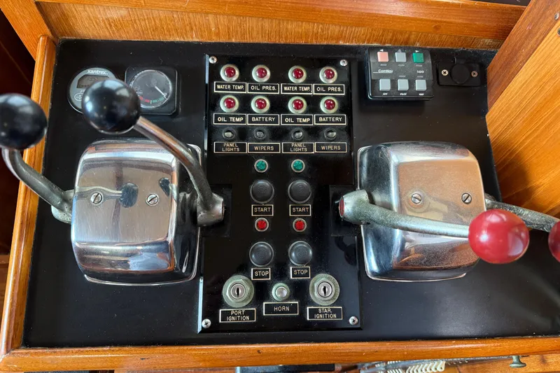 Slide: The Image of Control panel of a 1984 Chien Hwa 35 Trawler with levers and gauges. - 5