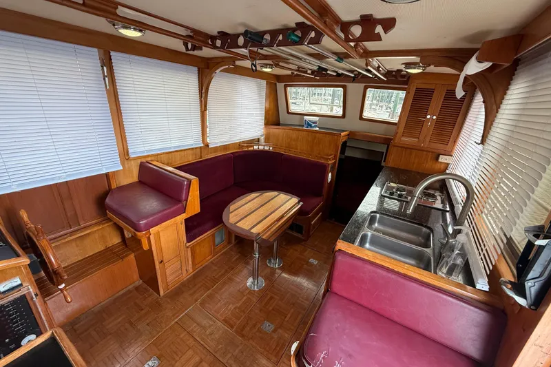 Slide: The Image of Interior of 1984 Chien Hwa 35 Trawler with wood accents and maroon seating. - 7