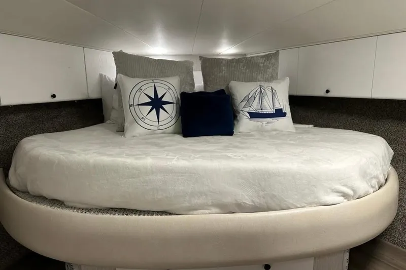 Slide: The Image of Cozy bedroom in 1995 Silverton 34 Convertible yacht with nautical-themed pillows. - 22