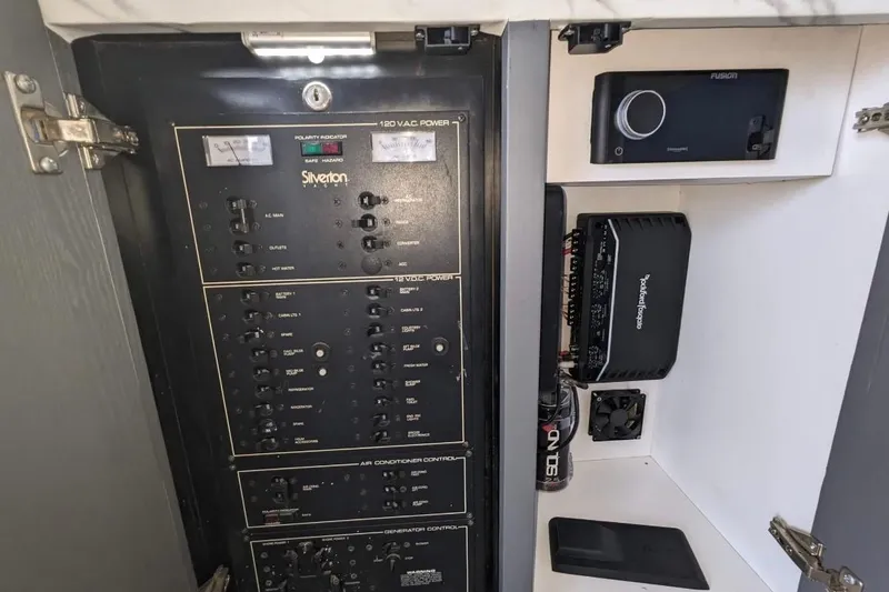 Slide: The Image of Electrical panel and audio system in 1995 Silverton 34 Convertible boat. - 23