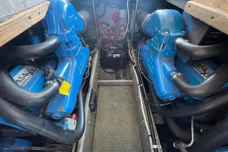Slide: The Image of Engine room of a 1995 Silverton 34 Convertible with twin blue engines. - 25