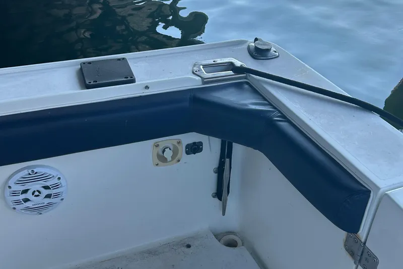 Slide: The Image of 1995 Silverton 34 Convertible boat interior with speaker and padded railing. - 31