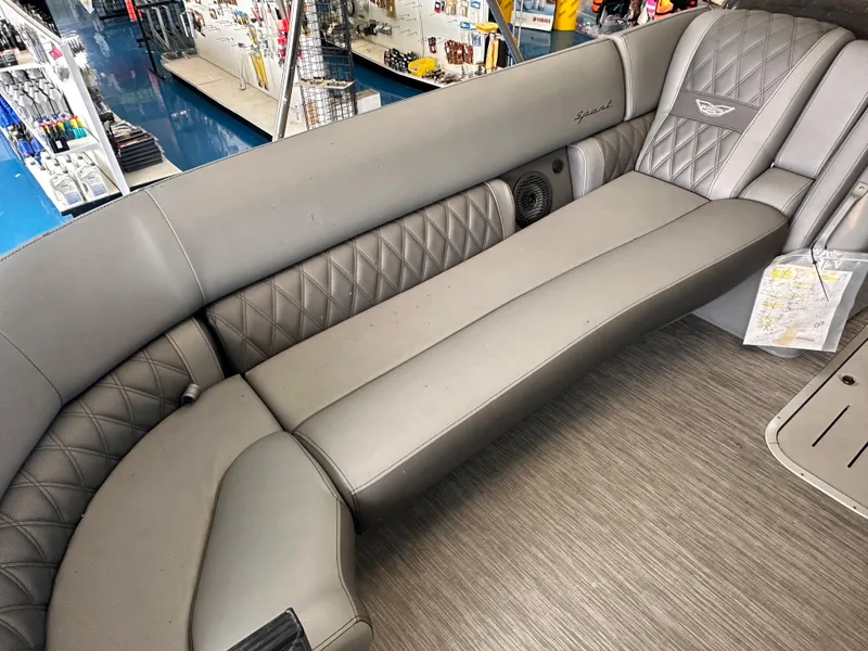 Slide: The Image of 2023 Bennington 25RSBA boat interior with gray quilted seating and modern design. - 6