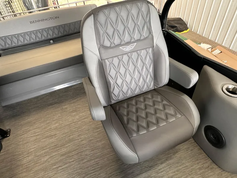 Slide: The Image of Luxurious seating in 2023 Bennington 25RSBA boat, featuring diamond-stitched upholstery and armrests. - 8
