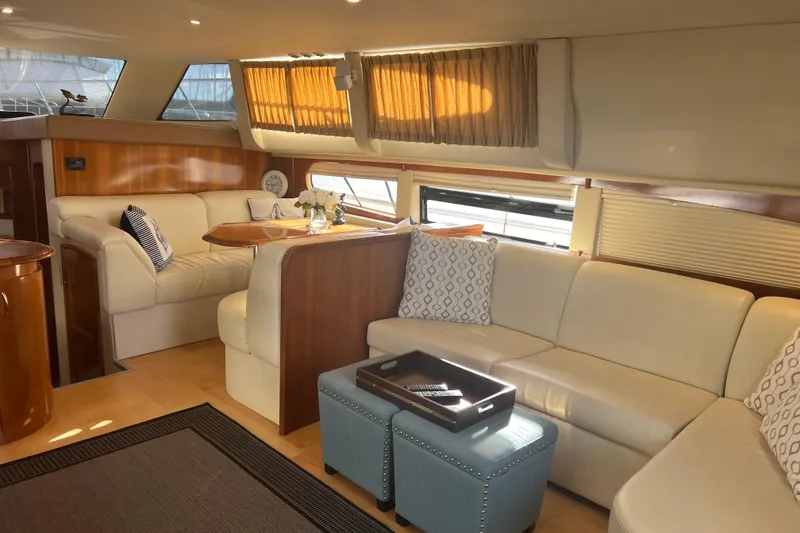Slide: The Image of Luxurious interior of 2004 Carver 466 MY yacht with elegant seating and decor. - 24