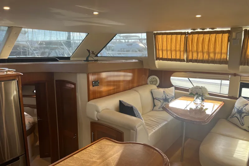 Slide: The Image of Luxurious interior of 2004 Carver 466 MY yacht with elegant seating and decor. - 27