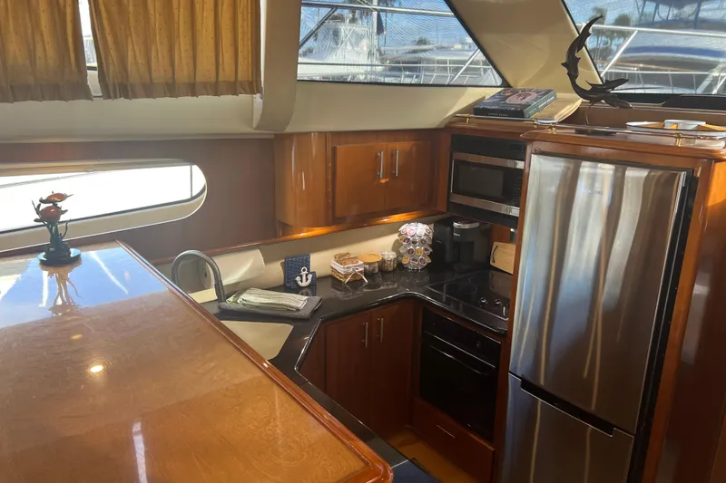 Slide: The Image of Luxurious kitchen interior of 2004 Carver 466 MY yacht with modern appliances. - 28