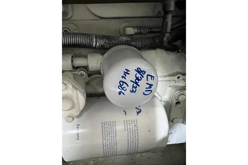 Slide: The Image of Engine component of 2004 Carver 466 MY with labeled filter and wiring. - 63