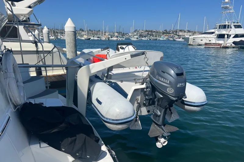 Slide: The Image of 2004 Carver 466 Motor Yacht with Yamaha outboard motor in marina setting. - 68