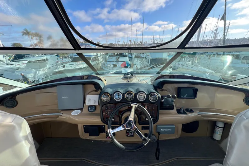 Slide: The Image of Helm of 2004 Carver 466 MY yacht with marina view and navigation equipment. - 9