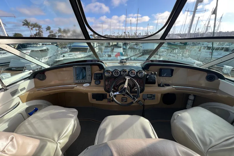 Slide: The Image of Interior view of 2004 Carver 466 MY yacht cockpit with steering wheel and navigation instruments. - 10