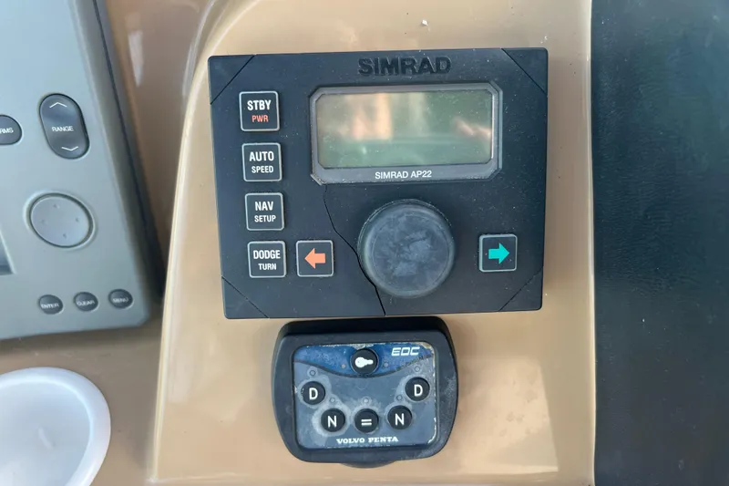 Slide: The Image of Control panel of a 2004 Carver 466 MY with Simrad AP22 autopilot system. - 12