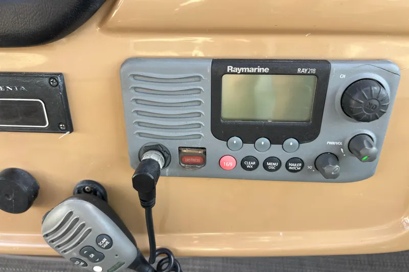 Slide: The Image of Raymarine RAY218 marine radio on 2004 Carver 466 MY dashboard. - 15